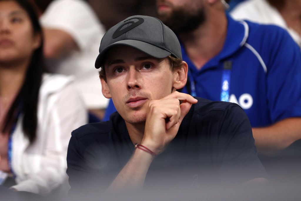 De Minaur watched on after winning his match on Rod Laver Arena