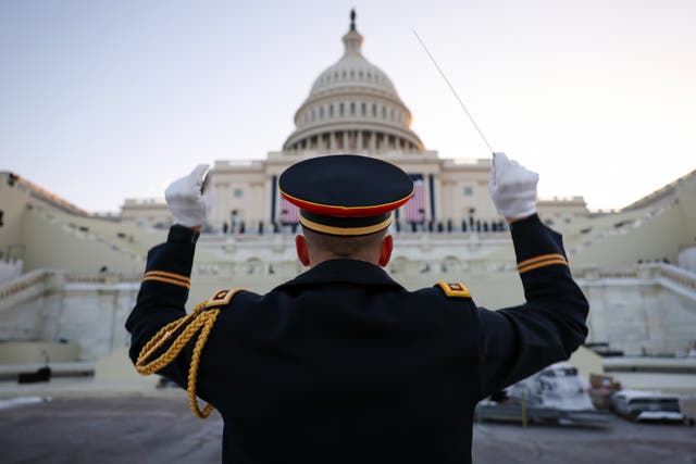 <p>Conductor for the Army Herald Trumpets Major Aaron Morris during rehearsals for the inauguration. Some betting options on what will happen during the event are already out </p>