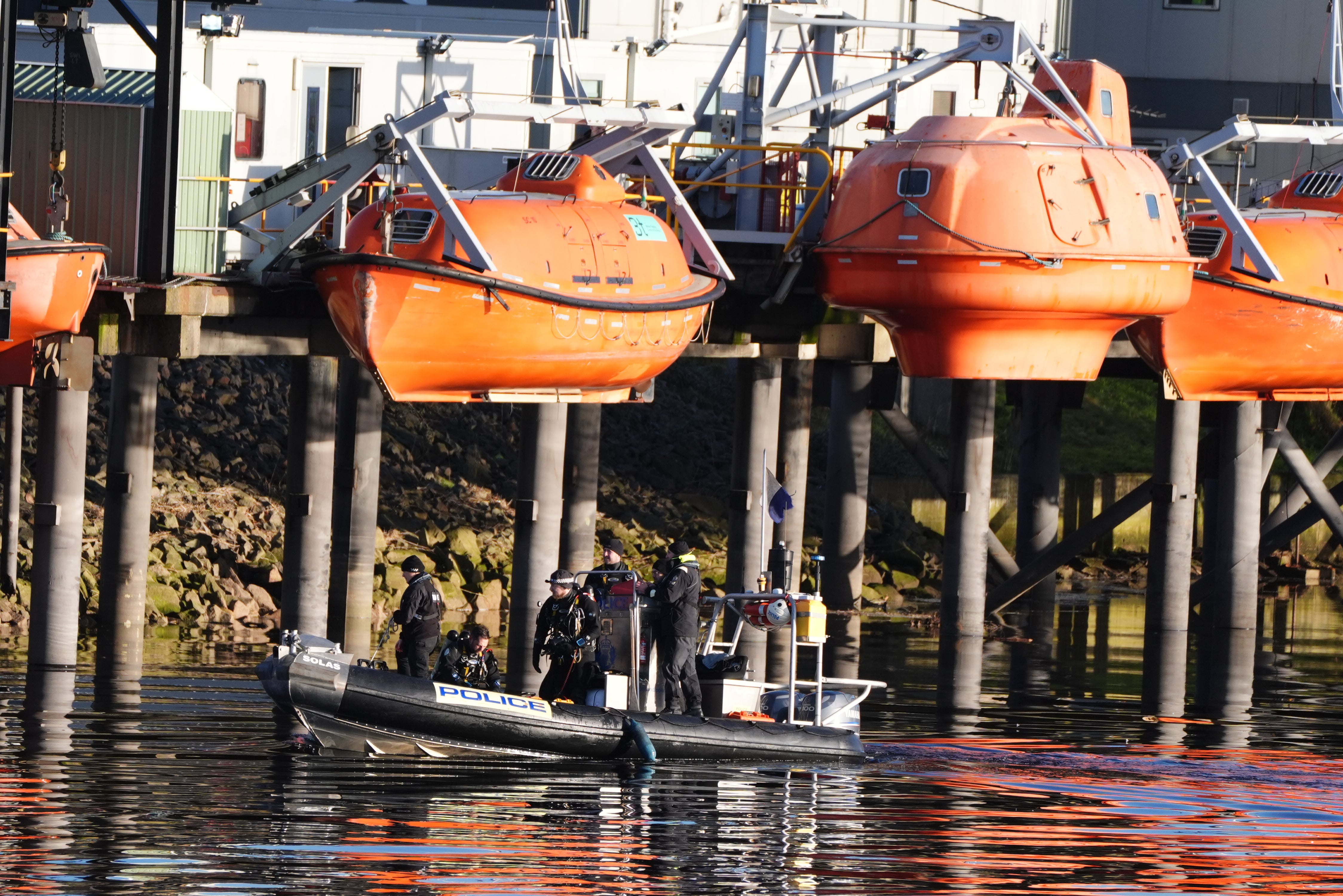 Police launch boats in hunt for missing siblings