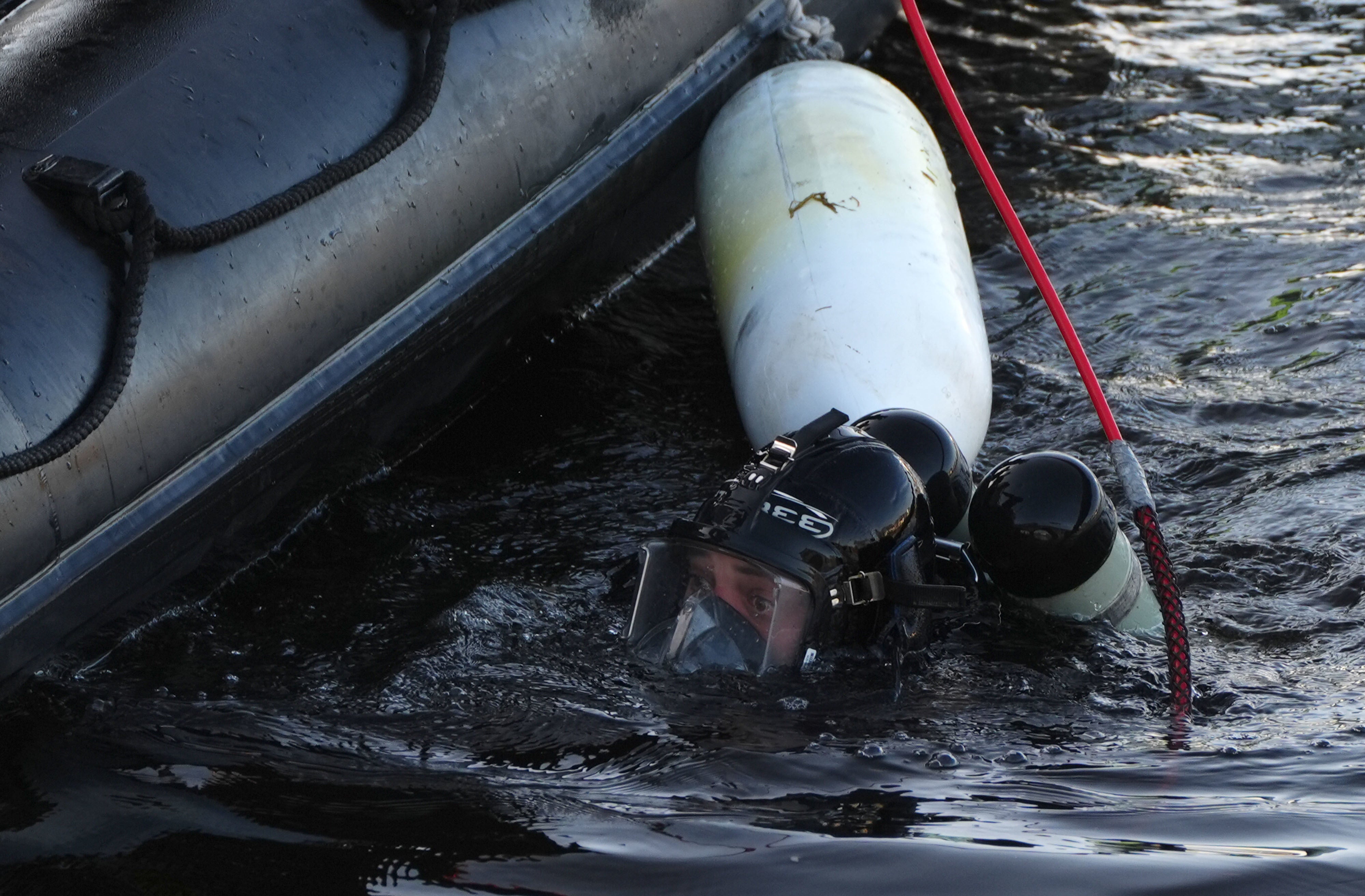 A police diver at Aberdeen harbour during the ongoing search for the missing sisters