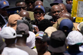 Rescuers pull survivors from South Africa mine as hundreds remain ...