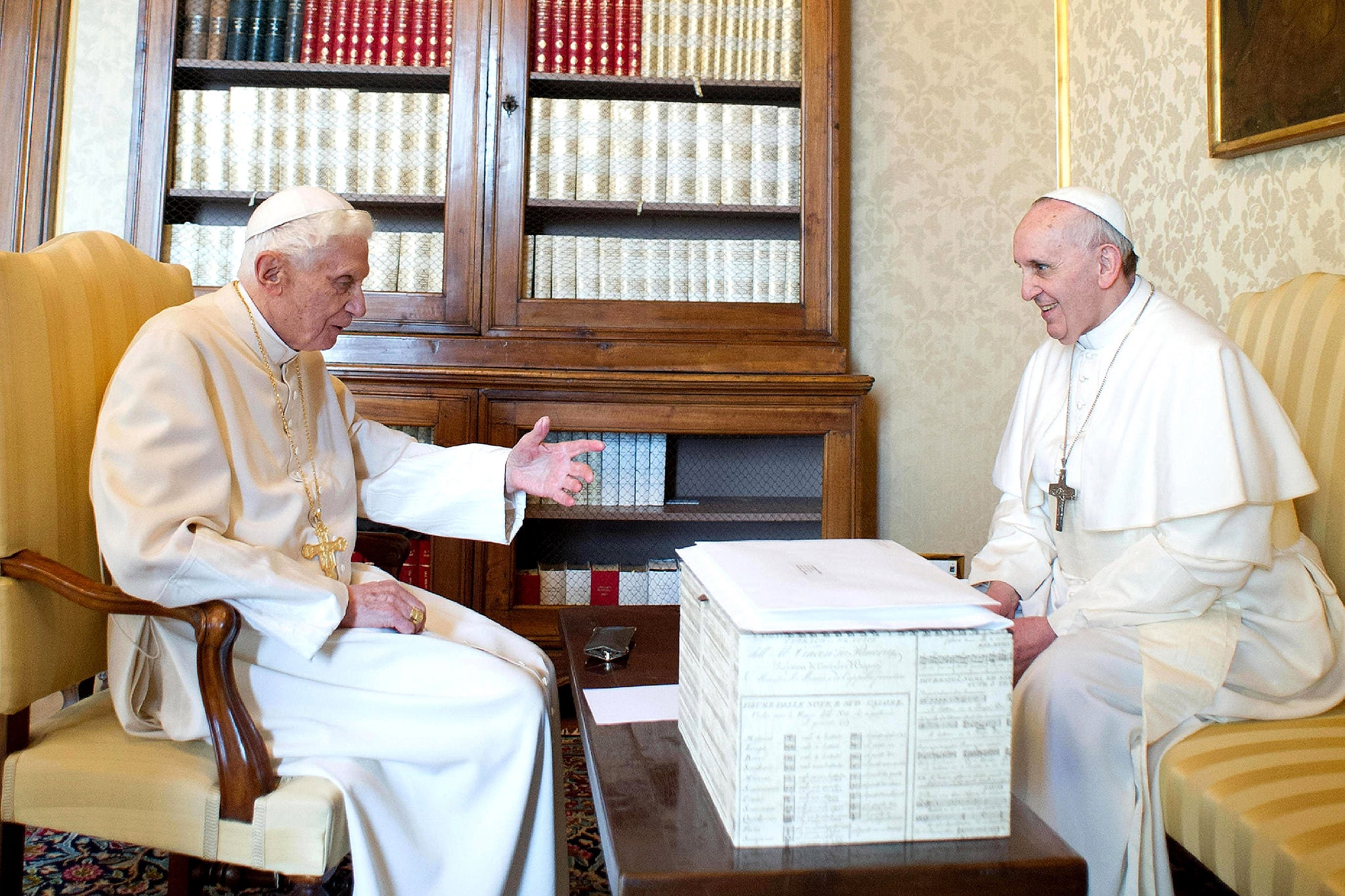 Benedict and Francis are pictured with a white box in their meeting at Castel Gandolfo in March 2013