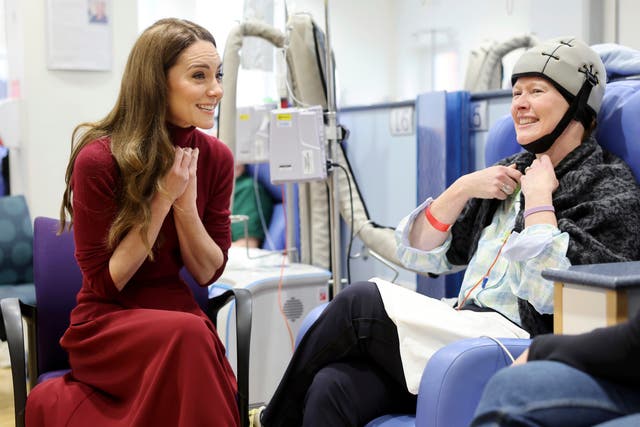 <p>Kate speaks to a patient at The Royal Marsden Hospital in central London </p>