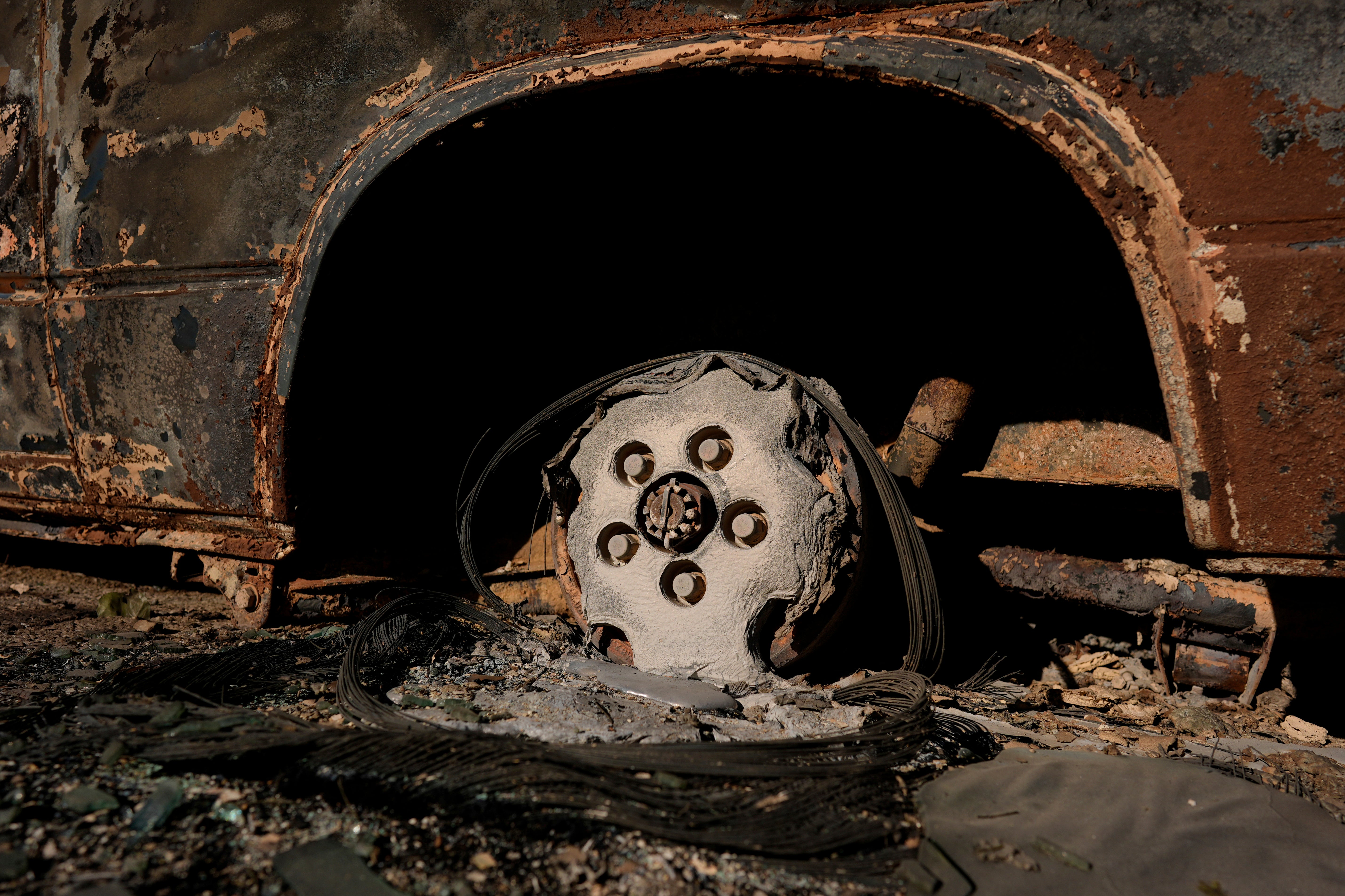 The remains of a burned vehicle are seen in the aftermath of the Eaton Fire on Monday in Altadena, California. Many vehicles were melted and burned in recent Los Angeles County blazes