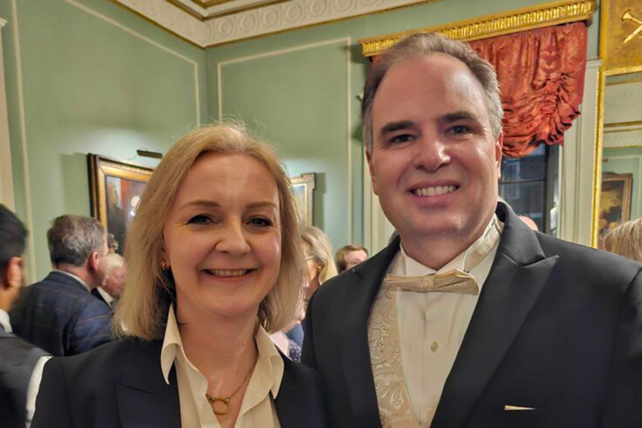 Former prime minister Liz Truss with James Taylor, the president of the Heartland Institute