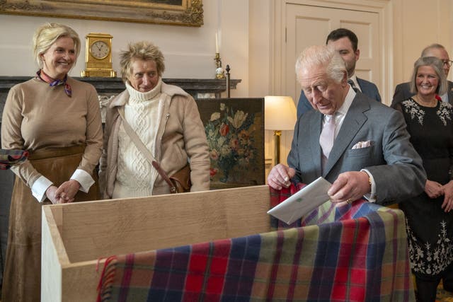 The King placed items in a time capsule at Dumfries House (Jane Barlow/PA)