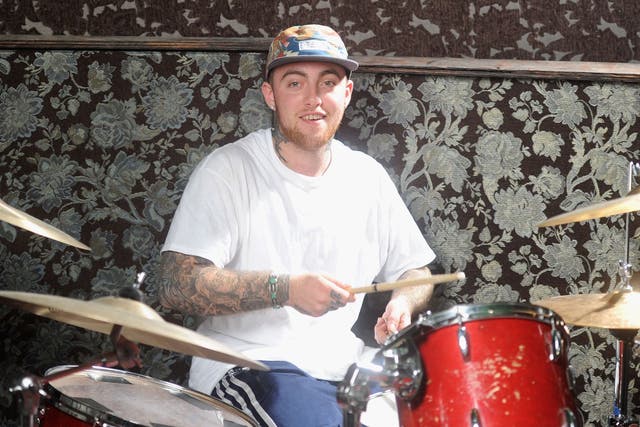 <p>The late musician Mac Miller pictured at a drum set in 2013</p>