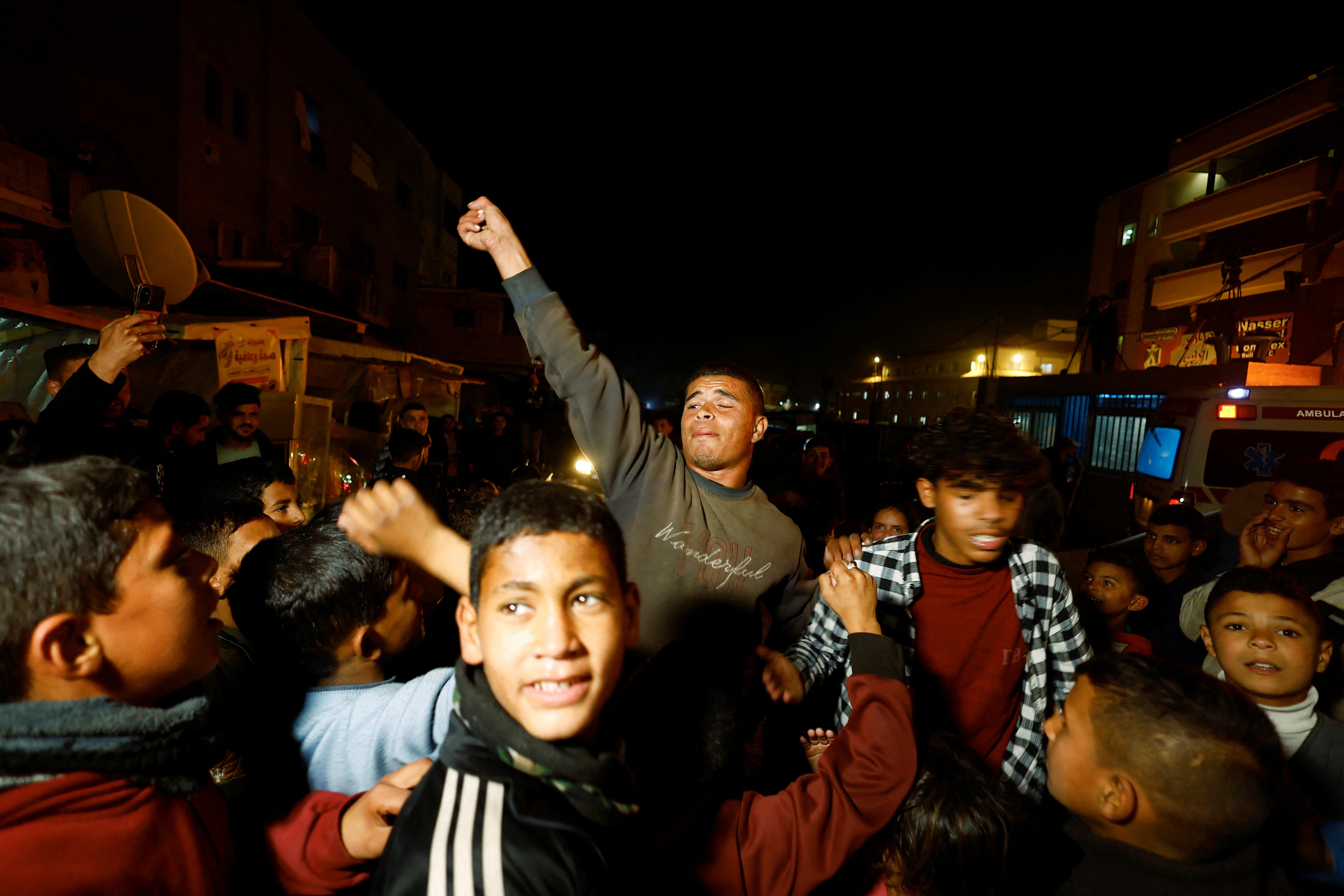 Palestinians celebrate in the street