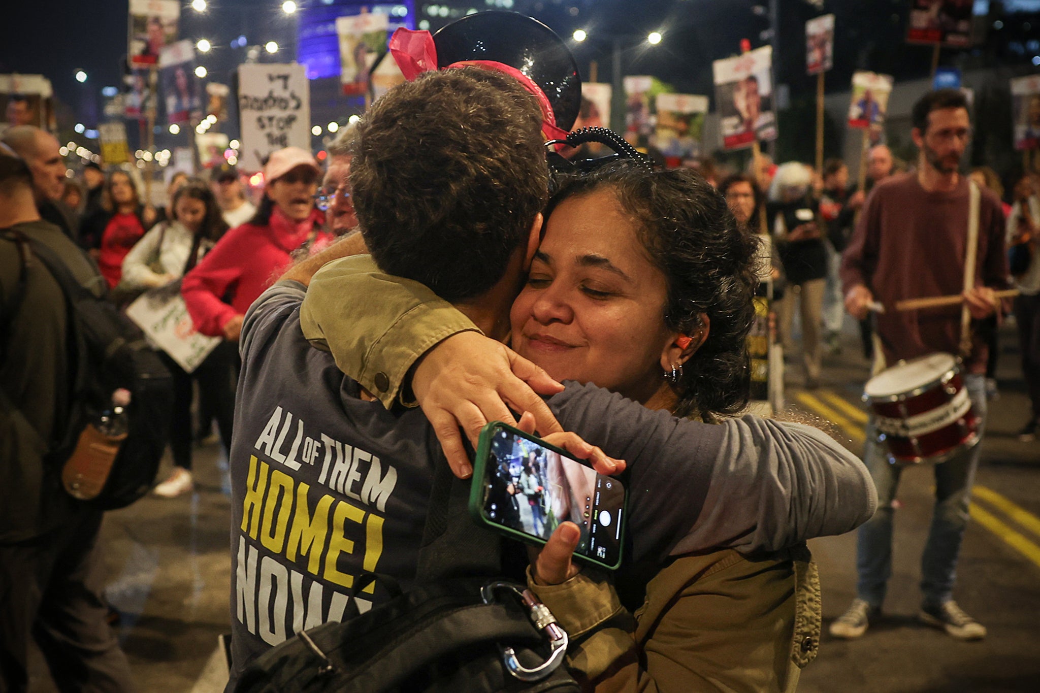 Supporters of Israeli hostages, who were kidnapped during the deadly October 7 2023 attack by Hamas, react to news on the Gaza ceasefire in Tel Aviv