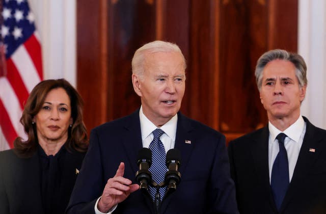 <p>Biden was flanked by vice president Kamala Harrys and secretary of state Antony Blinken as he spoke</p>