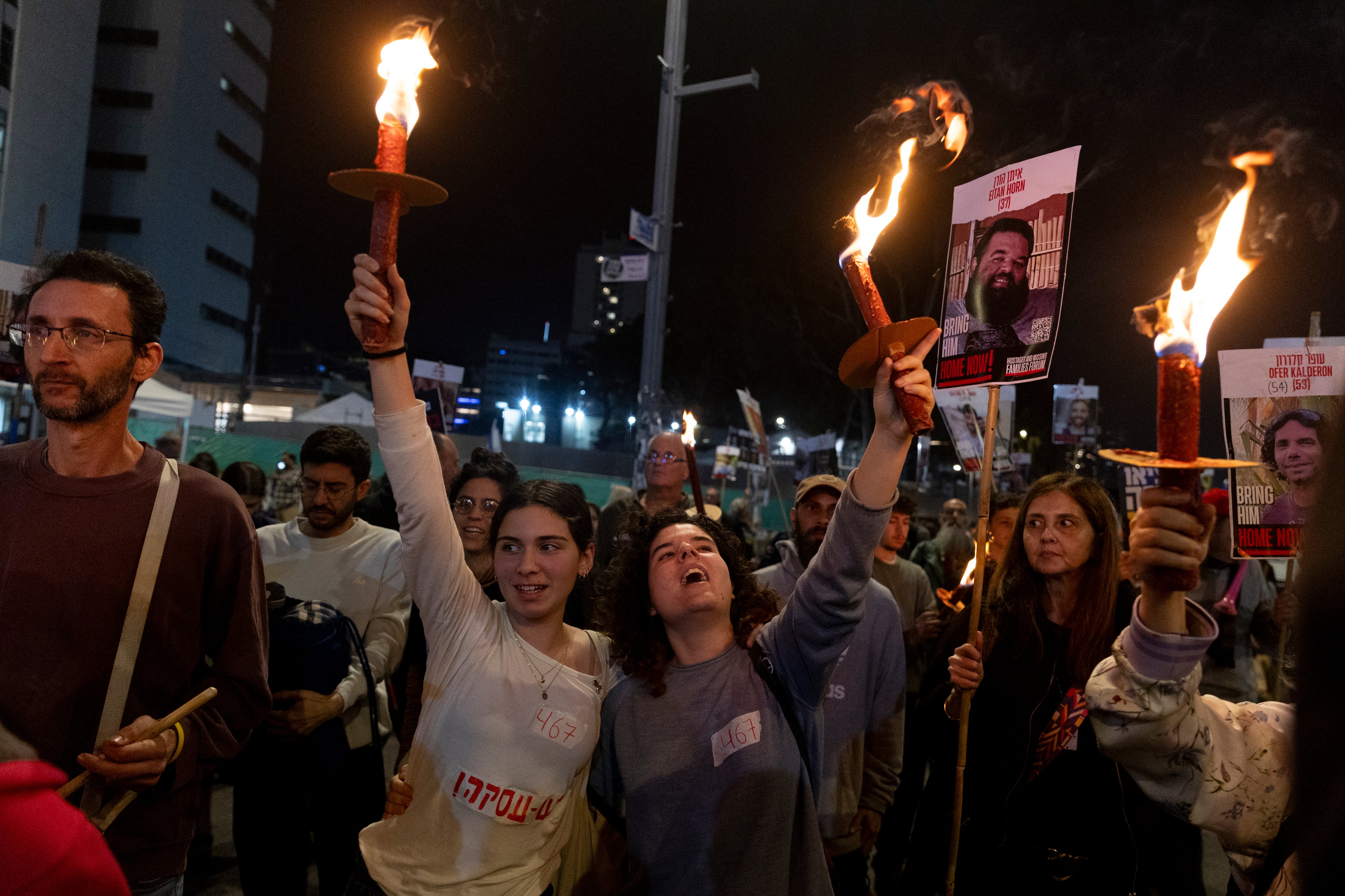 Protesters calling for the return of hostages held in the Gaza Strip react after a Gaza ceasefire and hostage release deal was reached on Wednesday