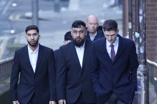 <p>Mohammed Fahir Amaaz (left) and Muhammed Amaad (centre) arrive at Liverpool Magistrates’ Court </p>