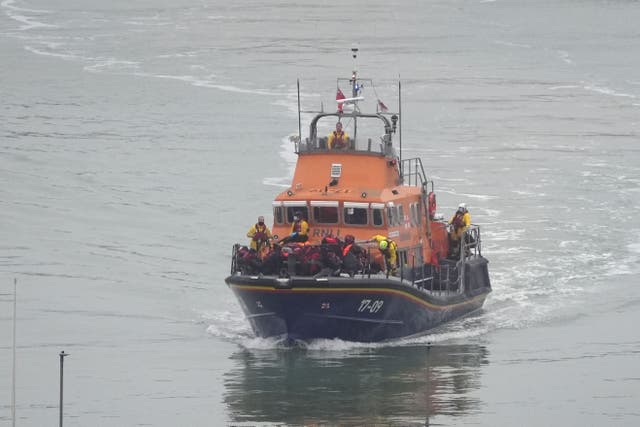 A group of people thought to be migrants are brought in to Dover, Kent, by the RNLI Dover Lifeboat following a small boat incident in the Channel (Gareth Fuller/PA)