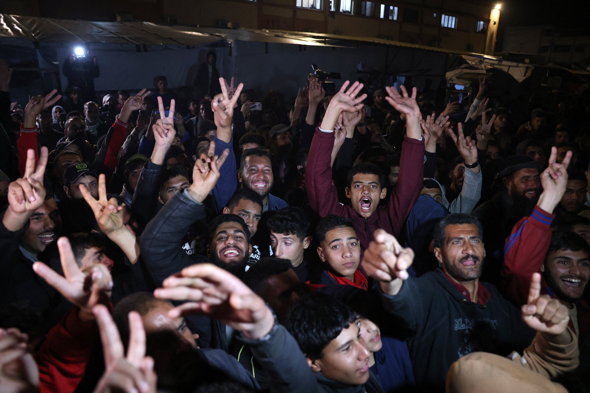 Young people celebrate the ceasefire in Khan Younis, Gaza