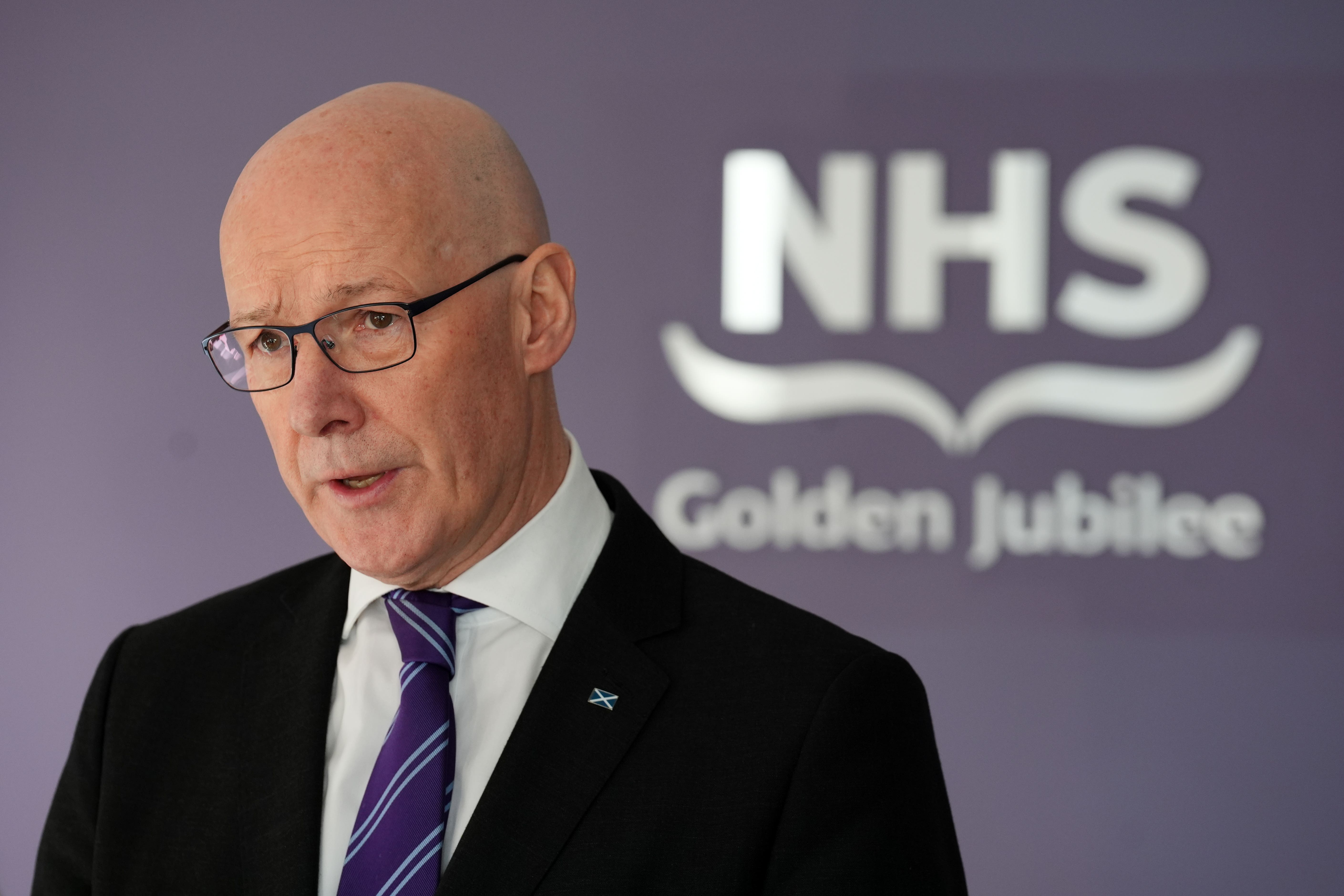 John Swinney has apologised to patients who has a negative experience in the NHS (PA)