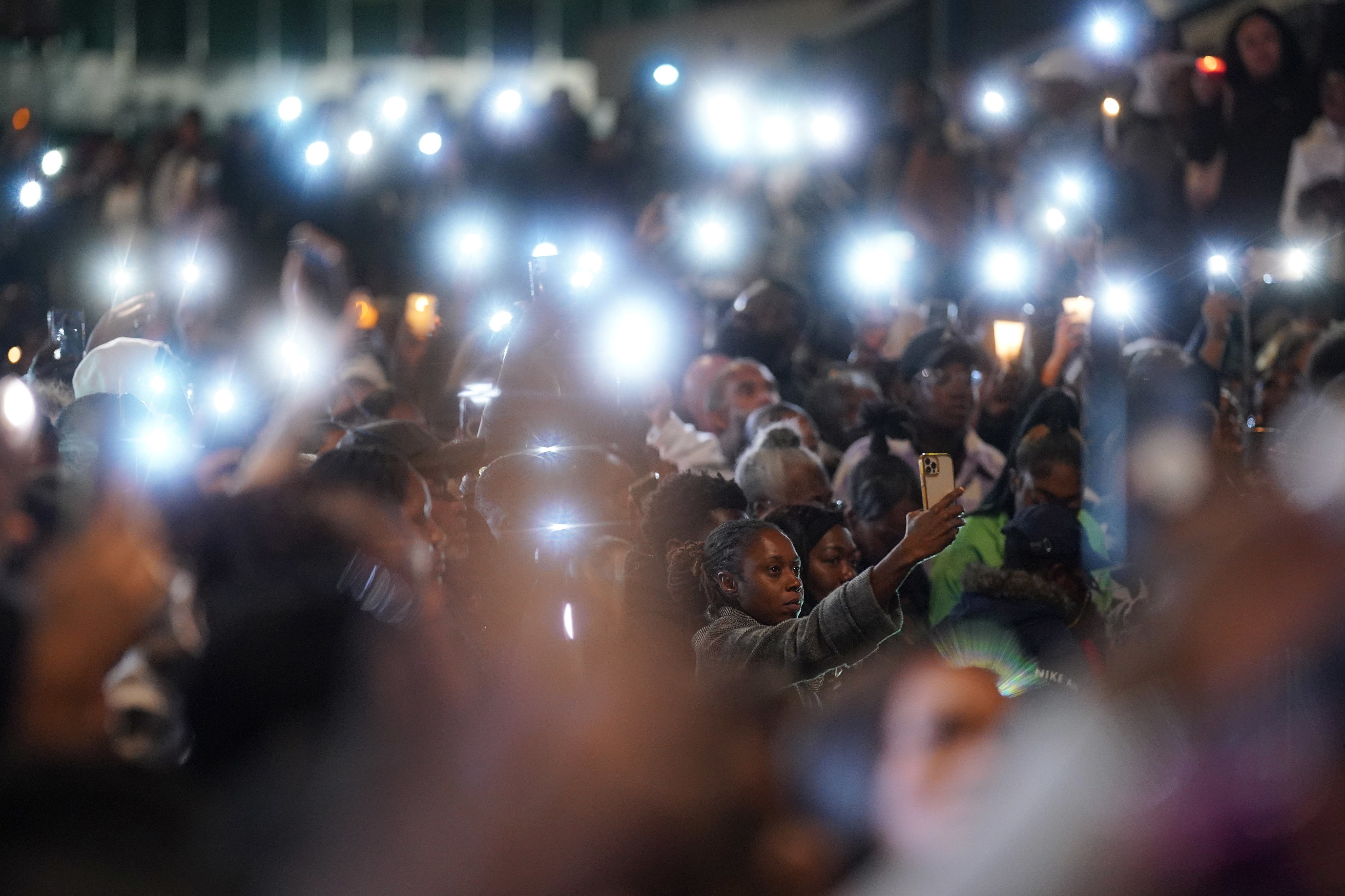 People attend a vigil outside the Whitgift shopping centre in Croydon, south London, a week after Elianne Andam was stabbed. October 4, 2023.