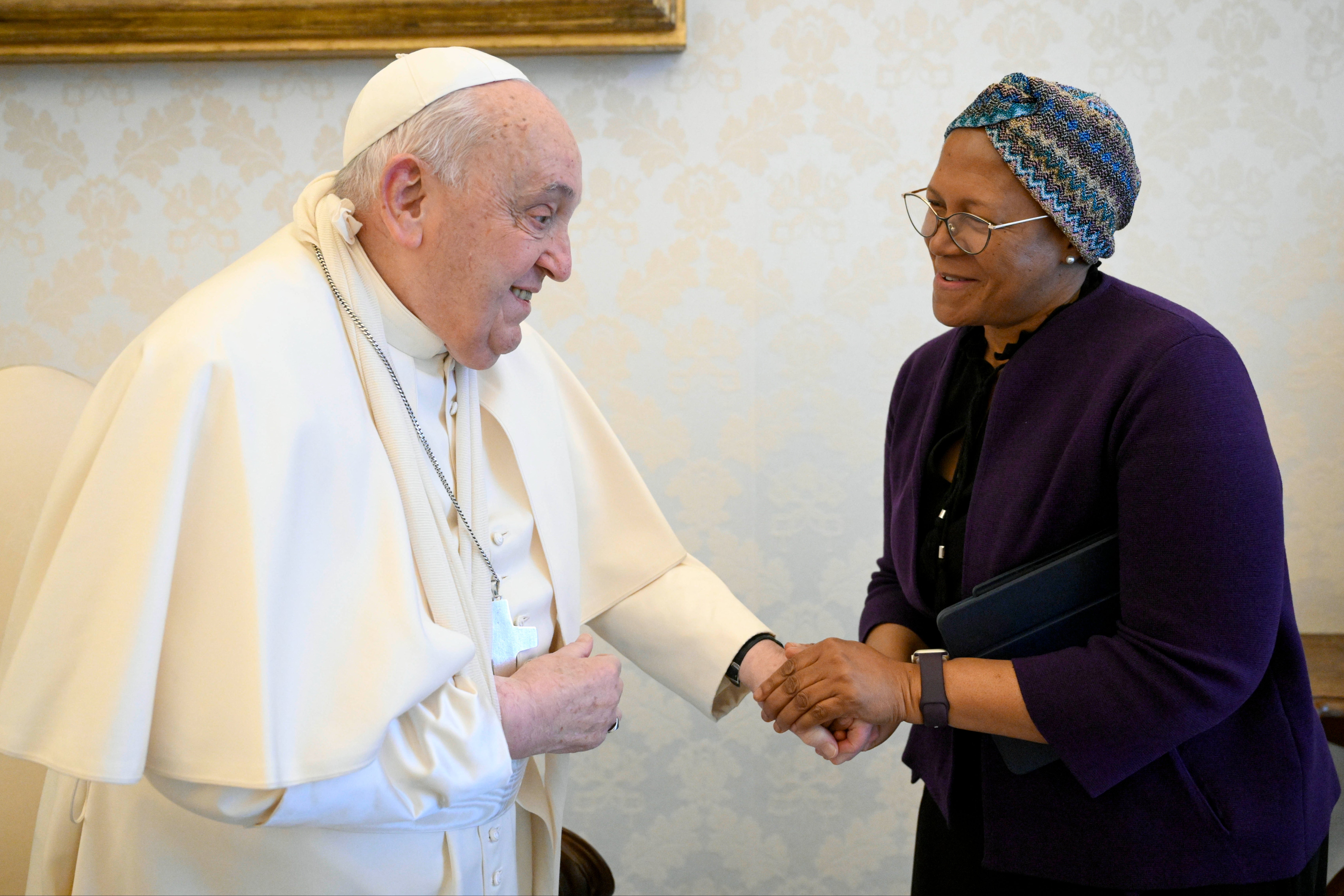 Pope Francis wores a sling on his right arm during his meetings at the Vatican