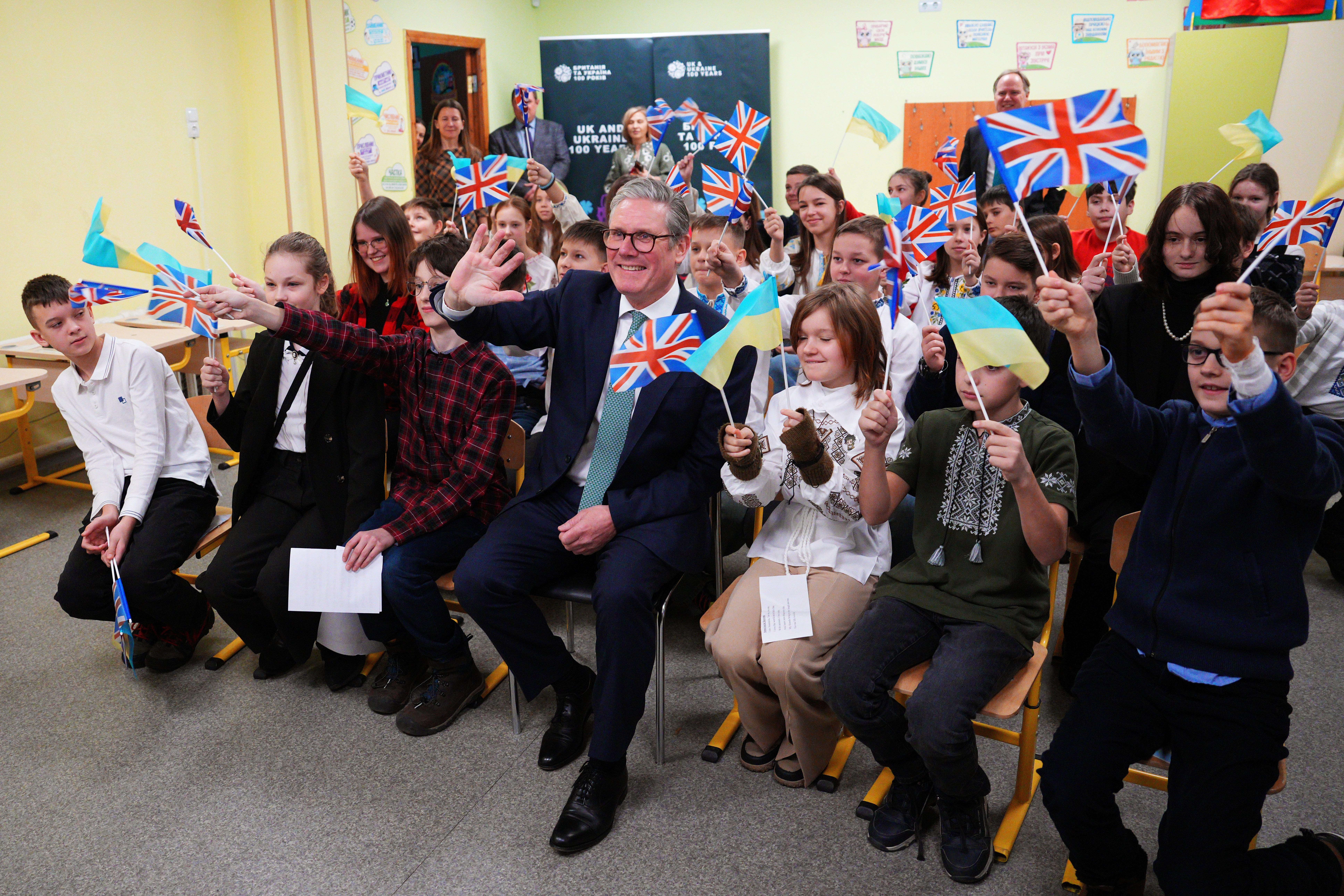 Sir Keir Starmer with schoolchildren in Ukraine (Carl Court/PA)