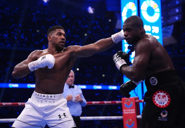 <p>Anthony Joshua (left) could face Deontay Wilder if Fury does not return (Bradley Collyer/PA)</p>