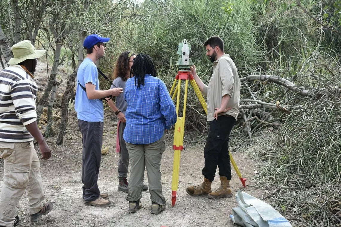 Co-authors from Tanzania, Canada, Kenya, Spain, and Germany, are gathered at Oldupai Gorge in Tanzania. Researchers were able to use data collected there to simulate the East African region more than a million years ago