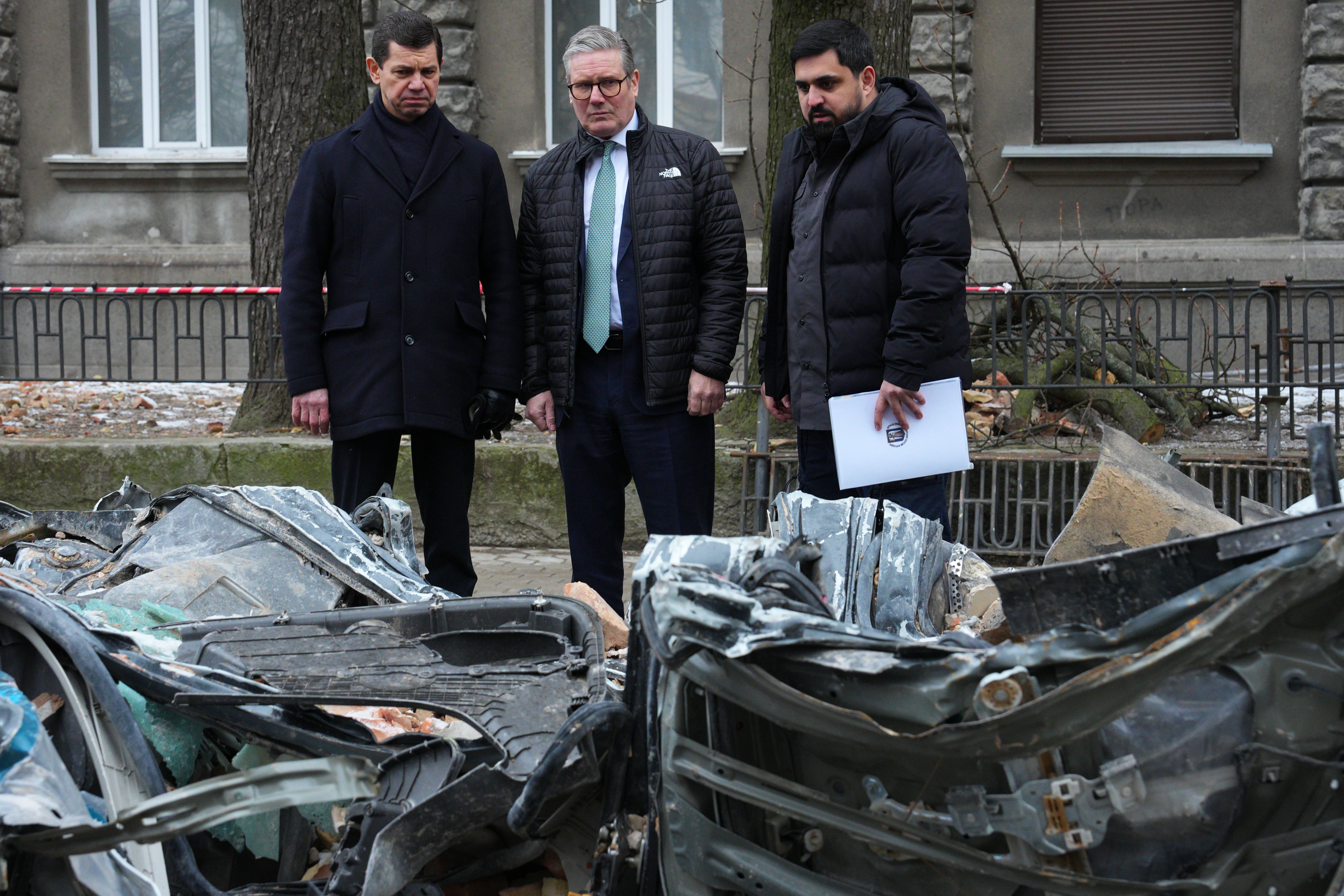 Sir Keir examines a vehicle damaged in a recent drone attack