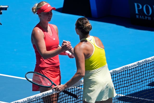 Aryna Sabalenka, right, shakes hands with Clara Tauson (Asanka Brendon Ratnayake/AP)