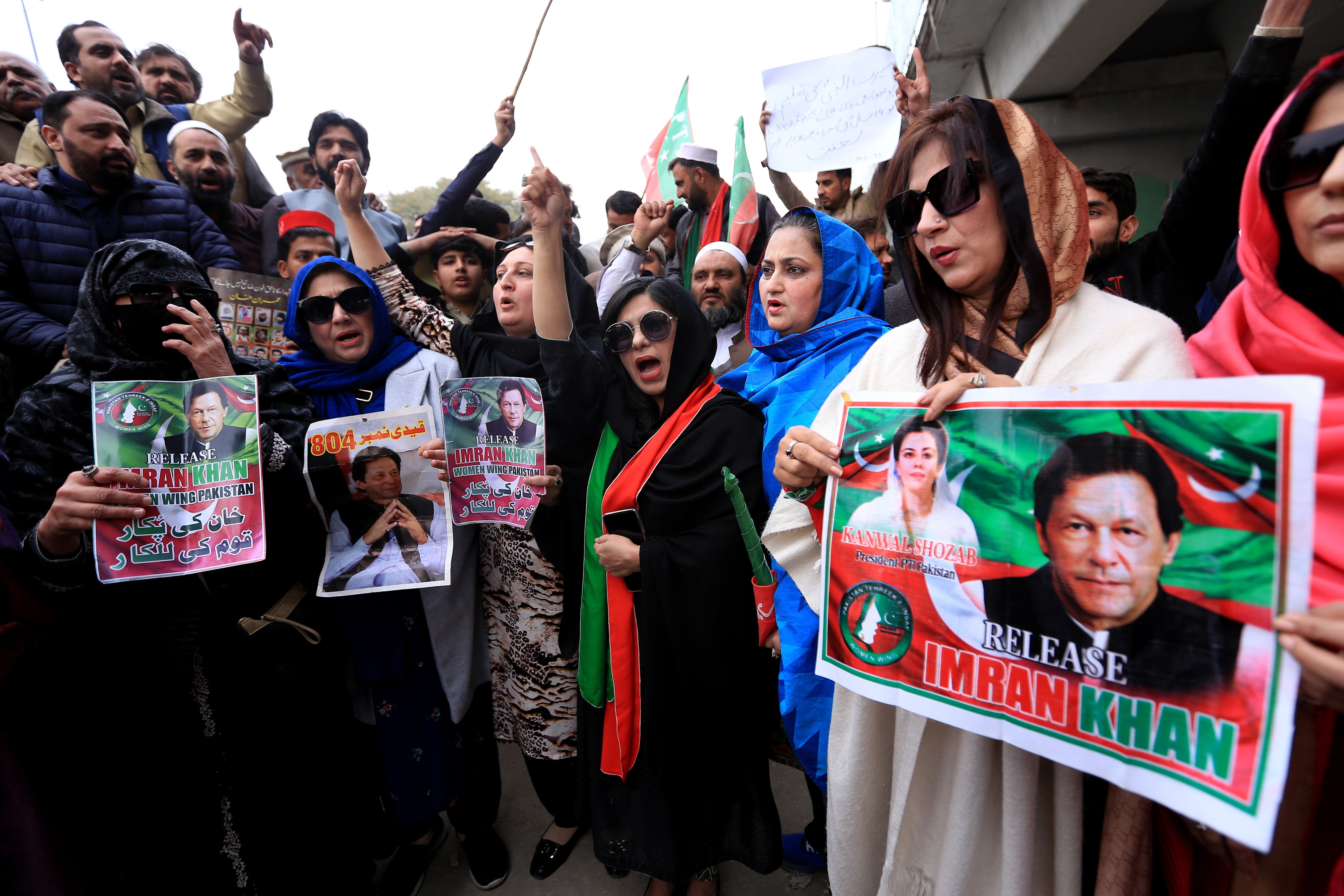 Supporters of the former prime minister Imran Khan shout slogans after a court sentenced him to 14 years in prison for corruption related to the Al-Qadir University Project Trust