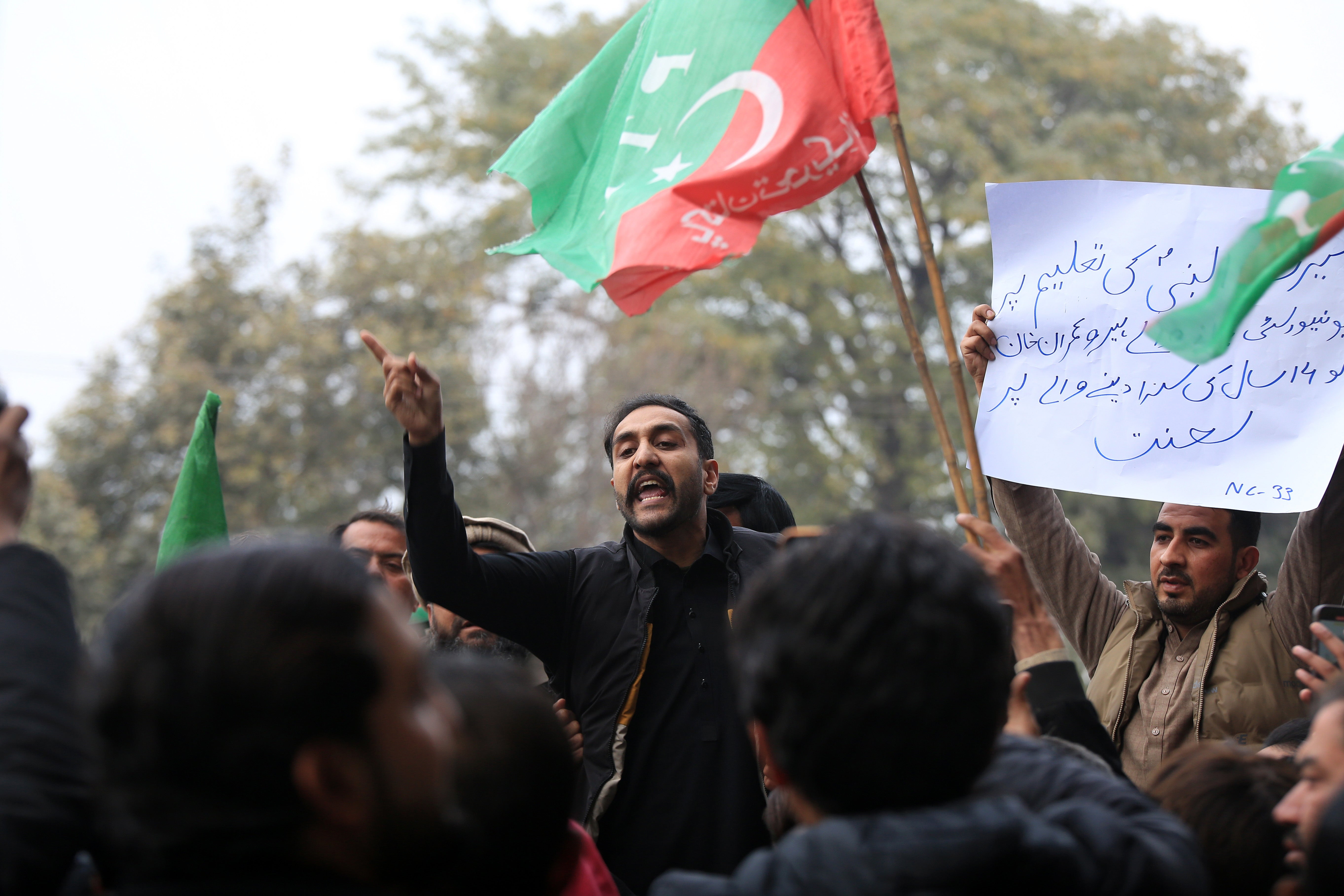 Supporters of the former prime minister, Imran Khan, shout slogans after a court sentenced him to 14 years in prison for corruption related to the Al-Qadir University Project Trust