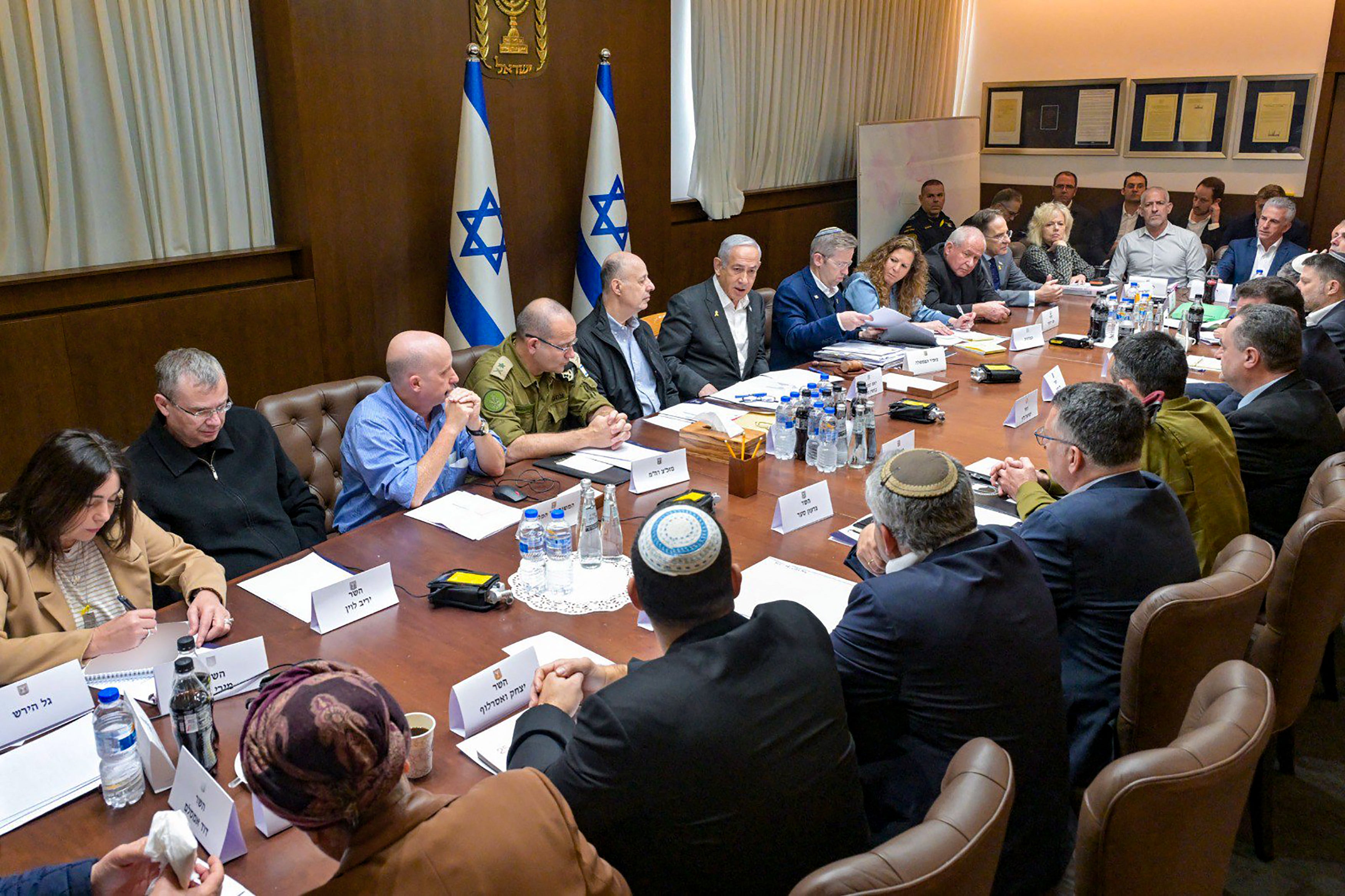 Benjamin Netanyahu (sixth from left) heads the security cabinet meeting in Jerusalem on Friday