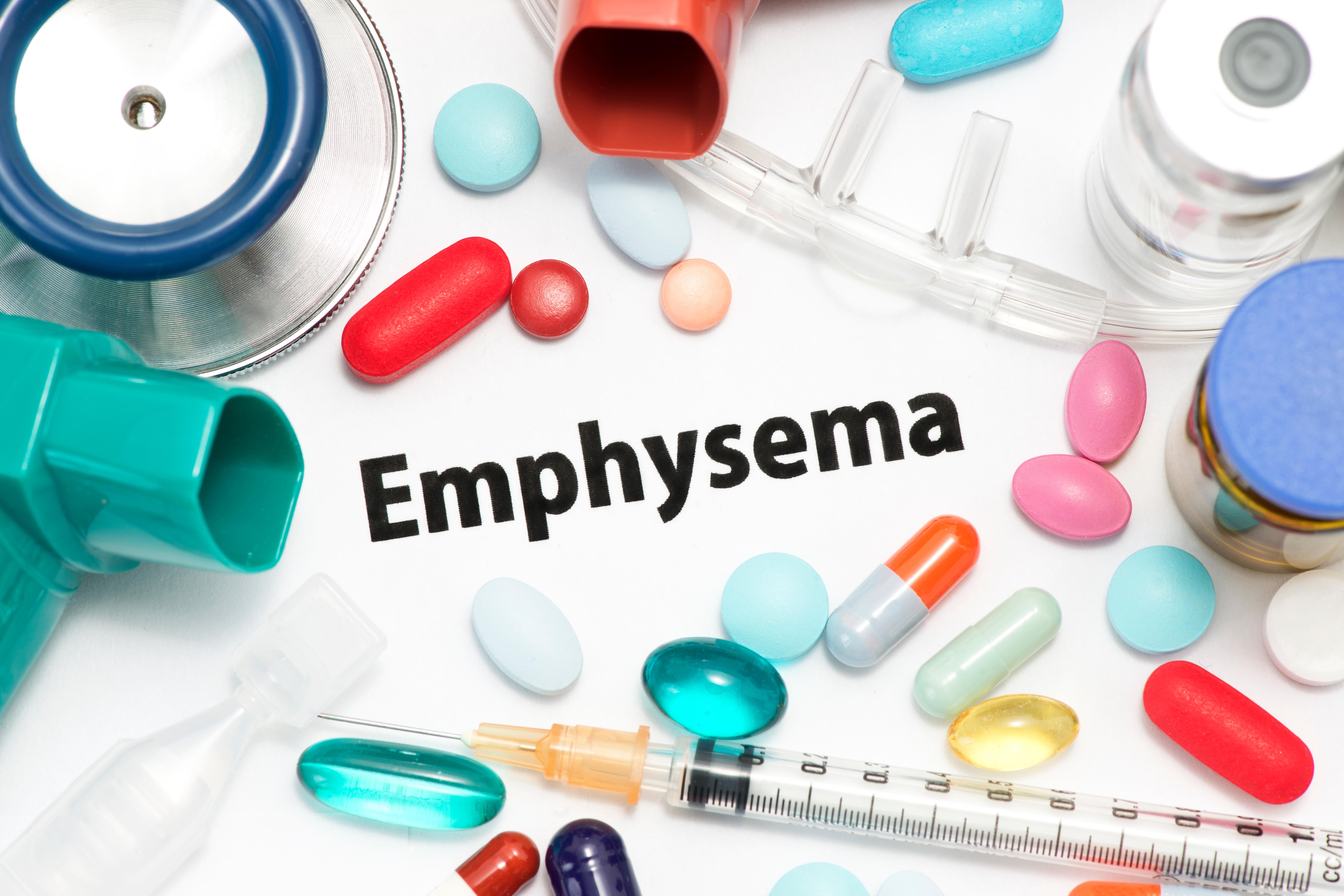 Emphysema concept photo with stethoscope, inhalers, and nasal cannula