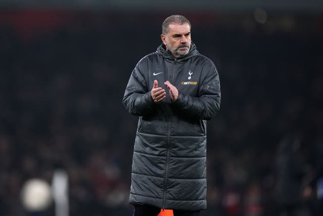 Ange Postecoglou applauds the Tottenham fans at Arsenal (PA)