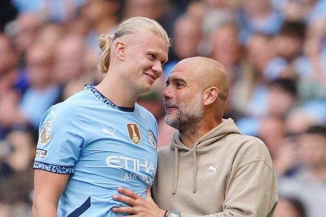 <p>Pep Guardiola (right) is happy to see Erling Haaland stay at Manchester City</p>