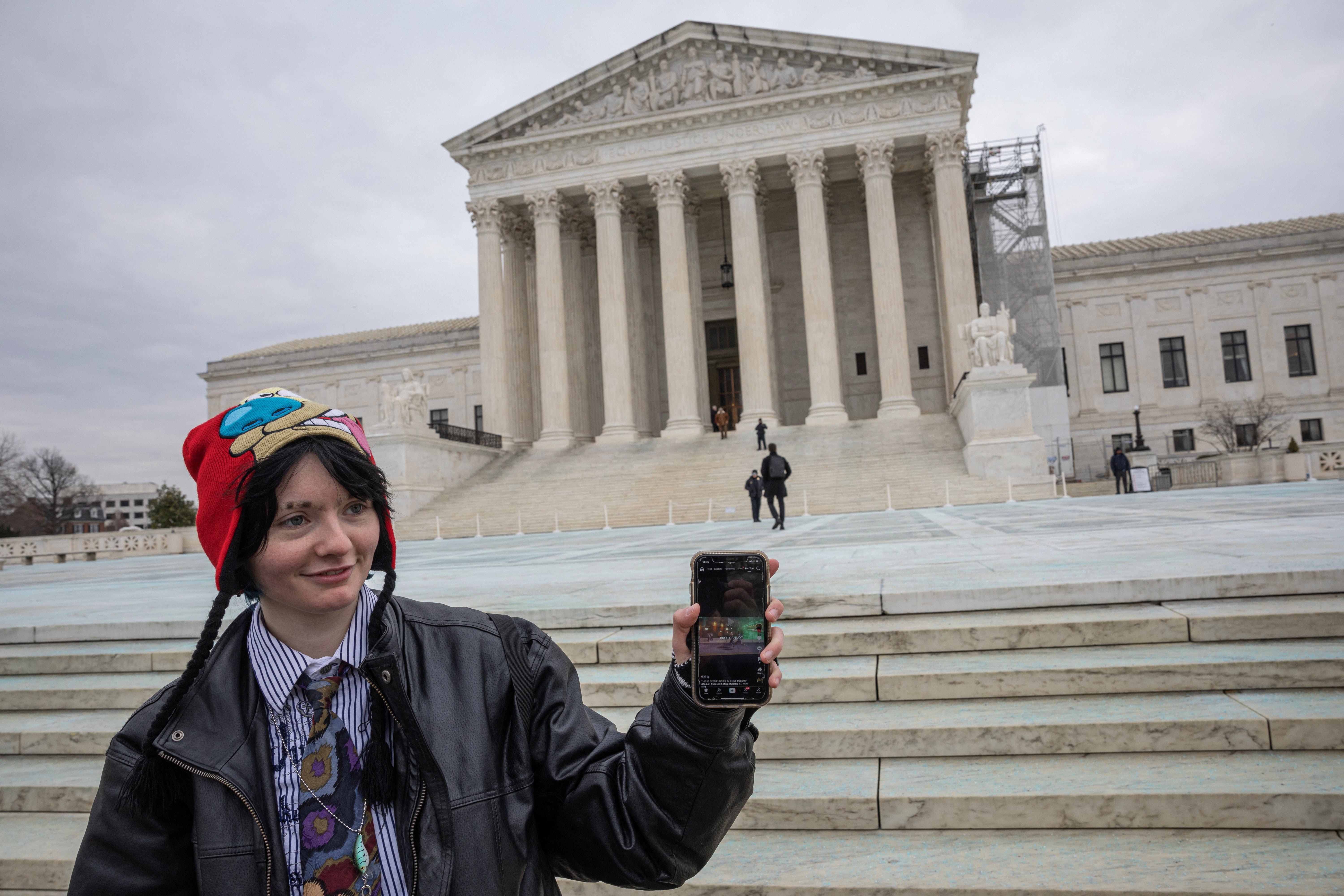 A woman shows her TikTok feed in front of the U.S. Supreme Court in Washington D.C. this week