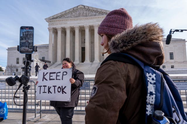 <p>Callie Goodwin, of Columbia, S.C., holds a sign in support of TikTok outside the Supreme Court, Friday, Jan. 10, 2025, in Washington. Goodwin, a small business owner who sells personalized greeting cards, says 80% of her sales come from people who found her on TikTok. </p>