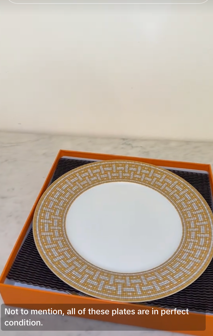 The content creator carefully opens each Hermès box