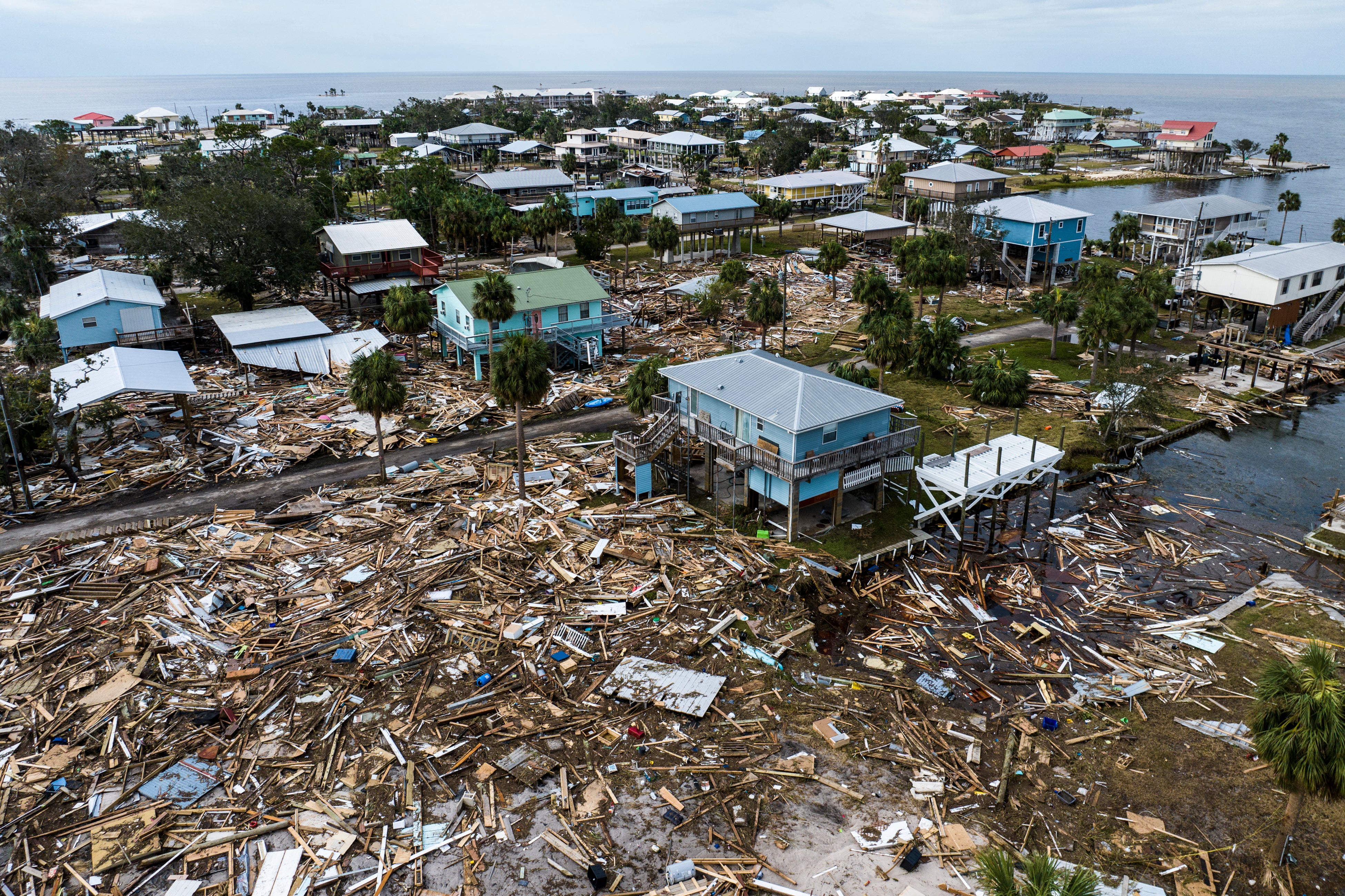 An aerial photo shows houses damaged after Hurricane Helene made landfall last September in Horseshoe Beach, Florida. Hurricanes wind speeds are increasing due to climate change