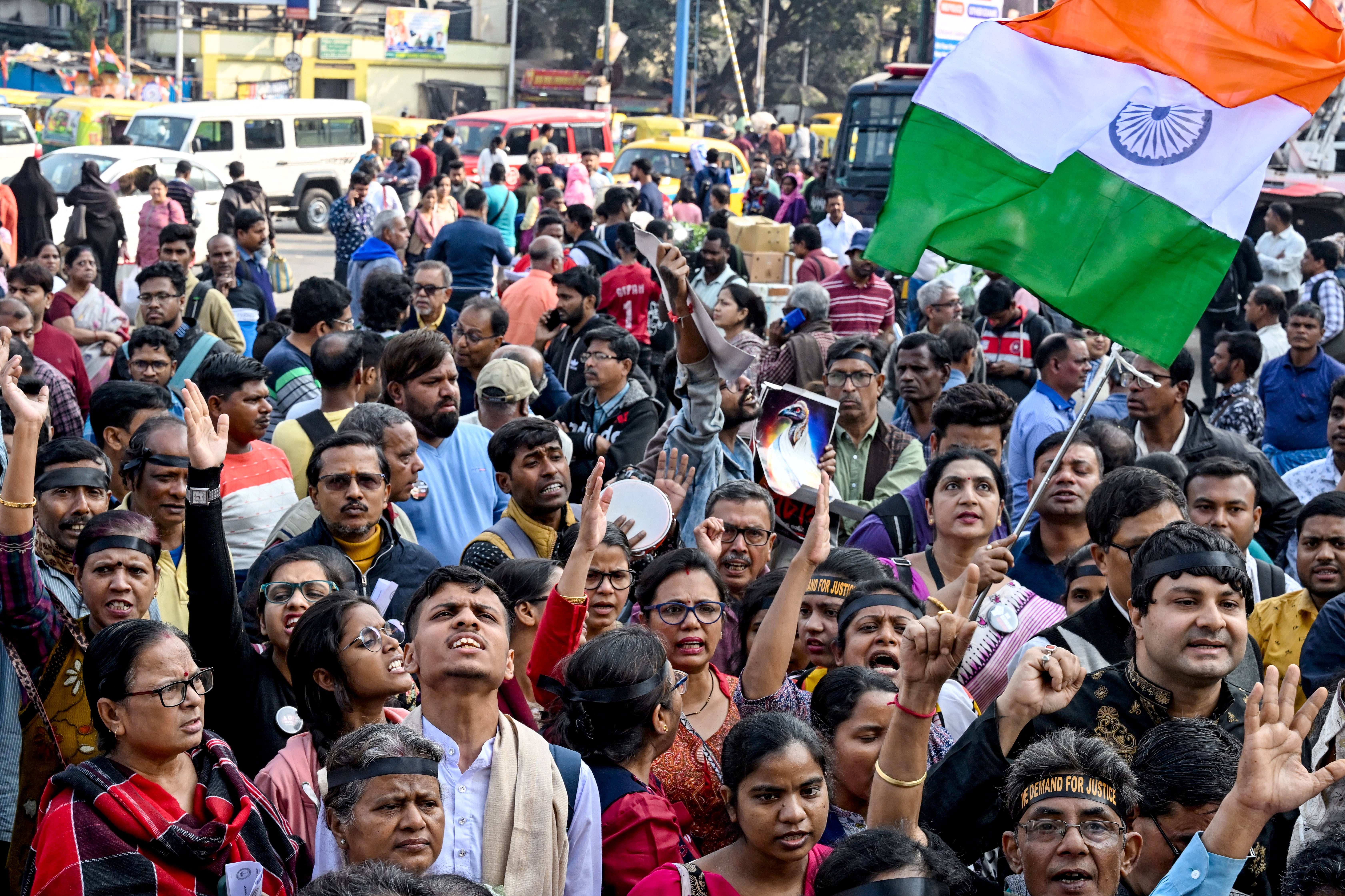 Protesters chant slogans to demand justice for victim