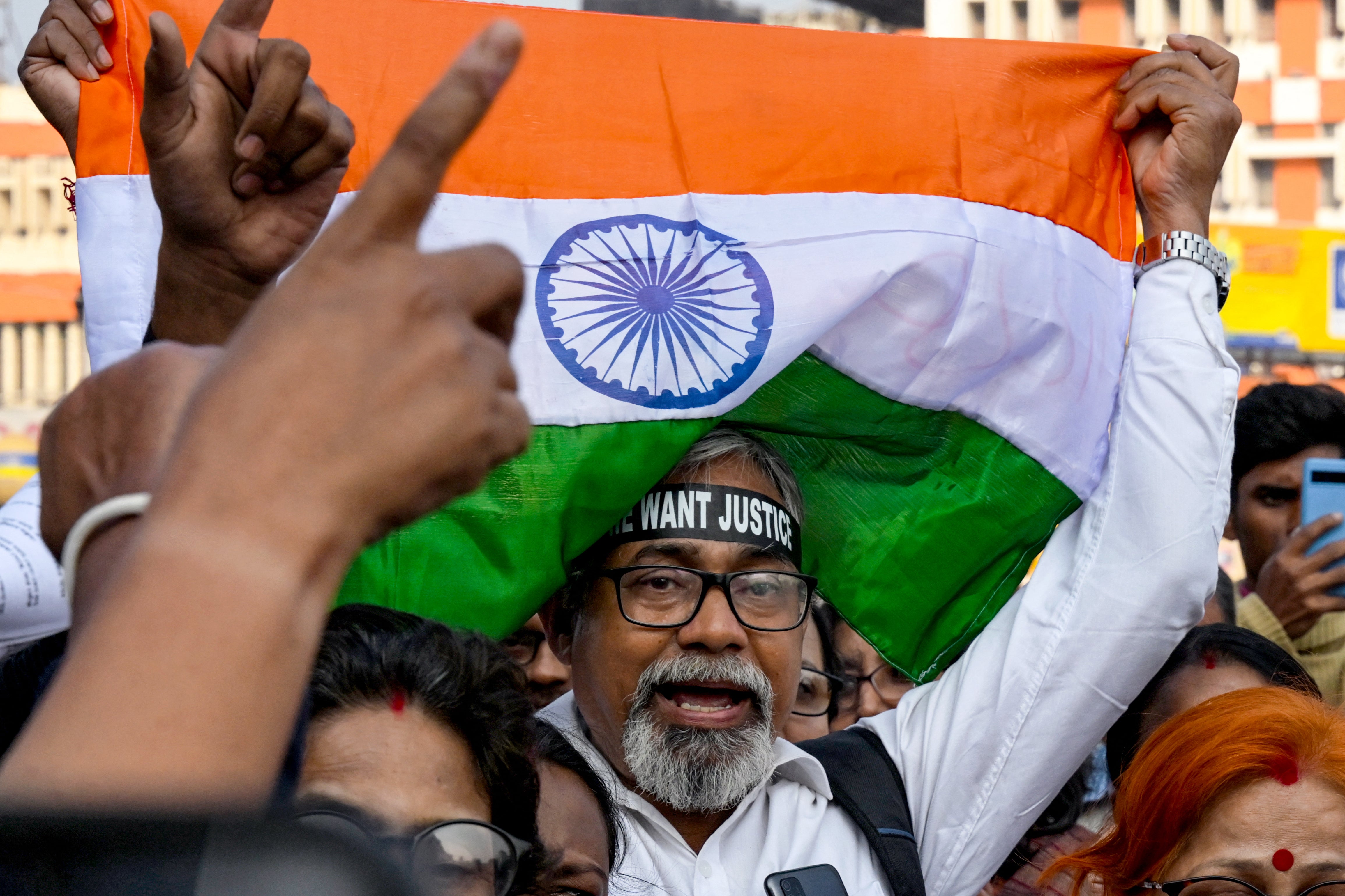 <p>Activists shout slogans near the Kolkata court where the trial of the RG Kar Medical College and Hospital rape and murder suspect is underway on 18 January 2025 </p>