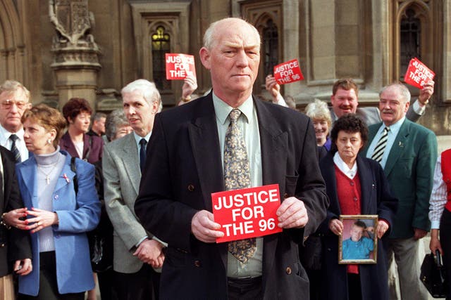 Phil Hammond at a demonstration by the families of the victims of the Hillsborough football ground disaster outside the Houses of Parliament in 1998 (PA)