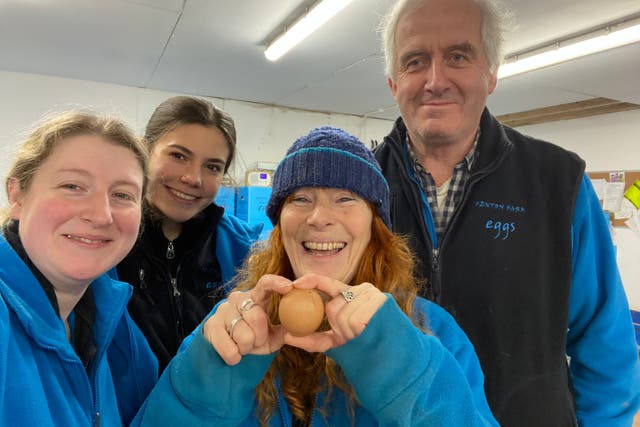 Ali Greene and colleagues with the egg (Ali Greene/Fenton Farm/PA)