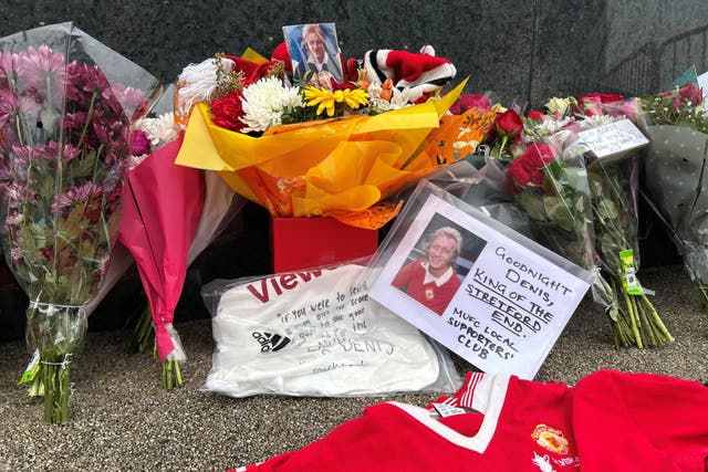 Manchester United fans have laid tributes to Denis Law outside Old Trafford (Martin Rickett/PA)