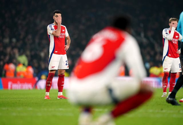 <p>Arsenal players reflect on the draw at full-time after letting a two-goal lead slip away</p>