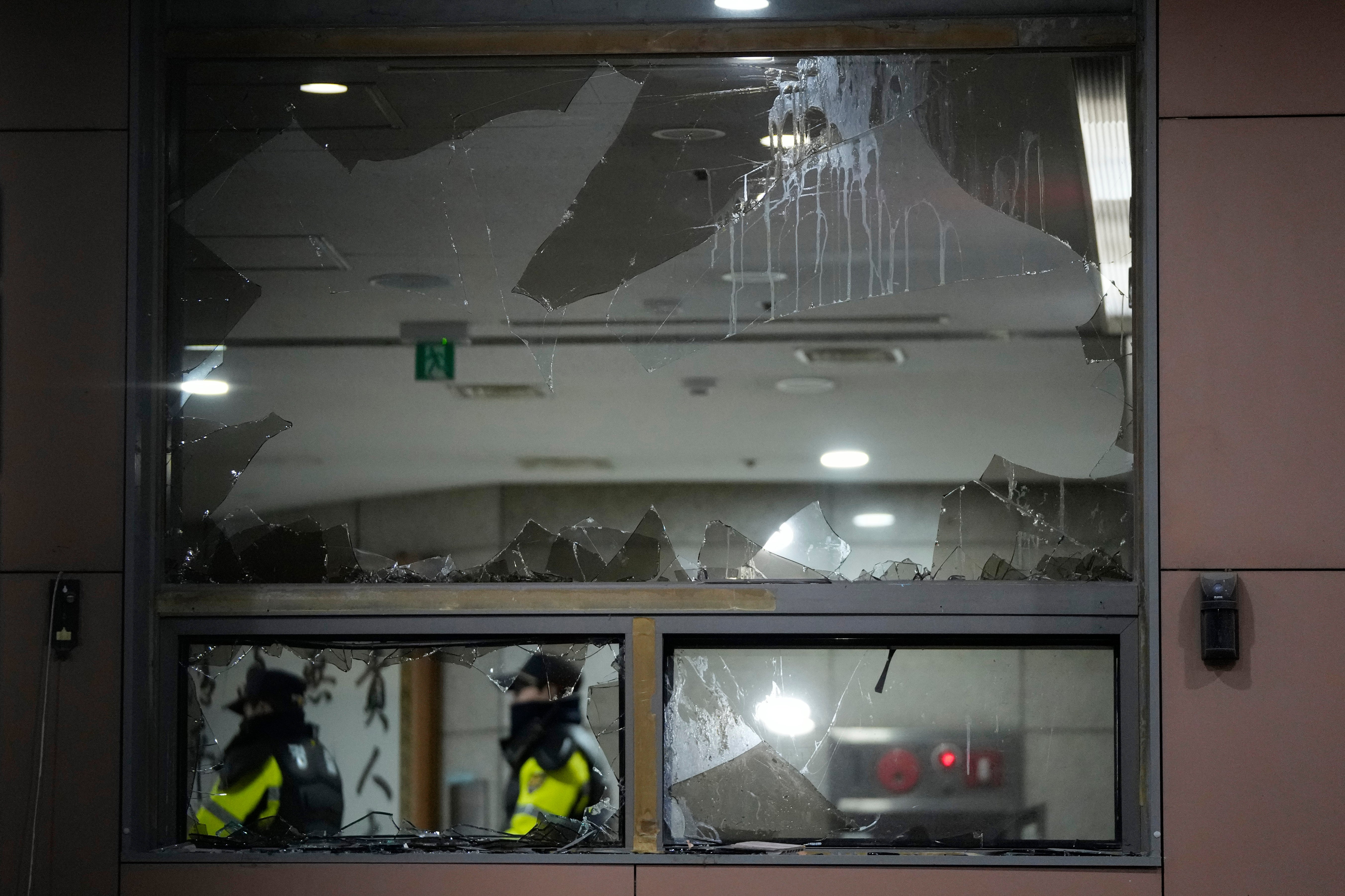 Police officers patrol inside Seoul Western District Court after supporters of impeached president Yoon Suk Yeol broke into the court on 19 January 2025