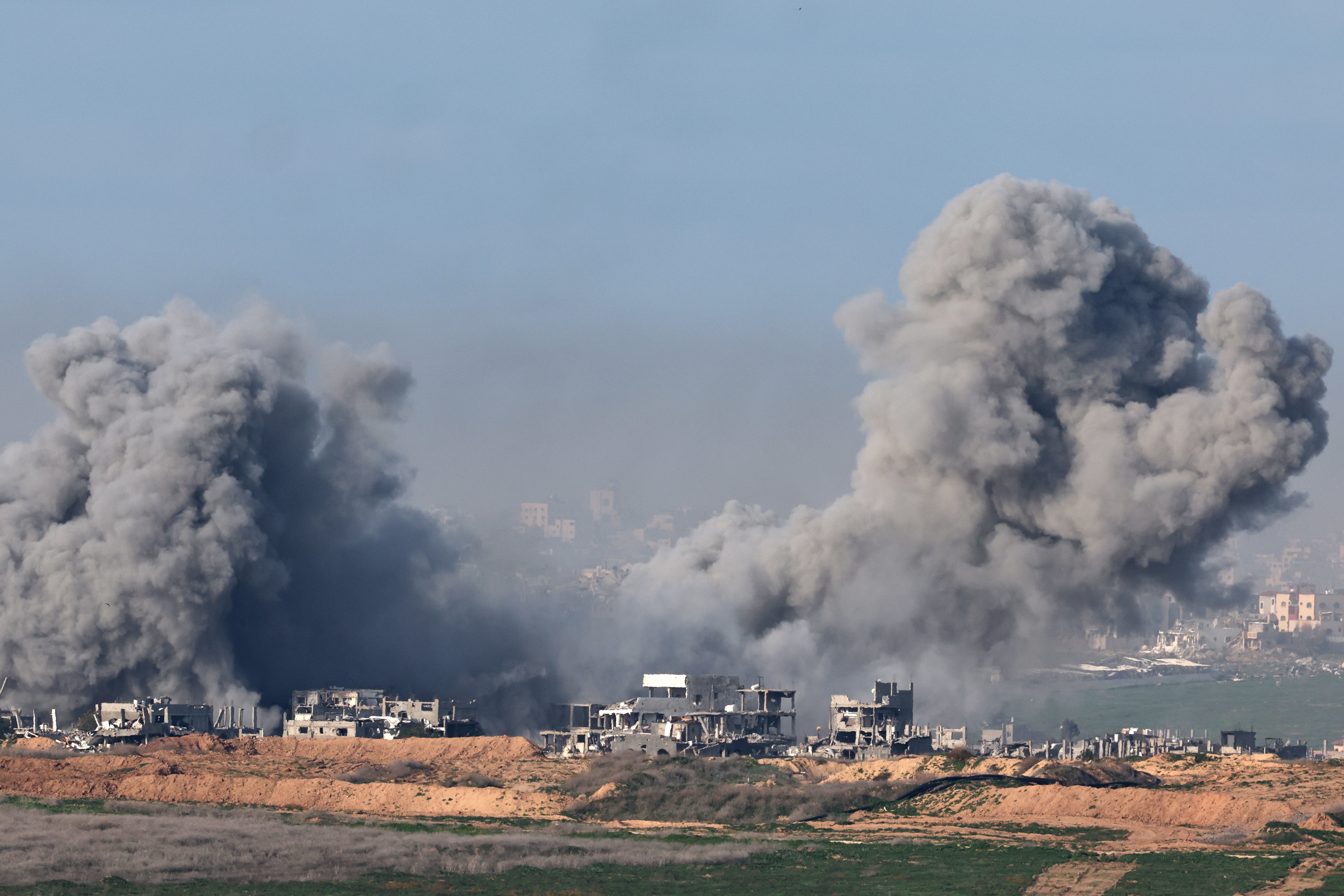 Smoke rises from buildings in Gaza on Sunday morning