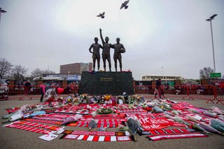 A statue of Manchester United trio of George Best, left, Denis Law, center, and Sir Bobby Charlton