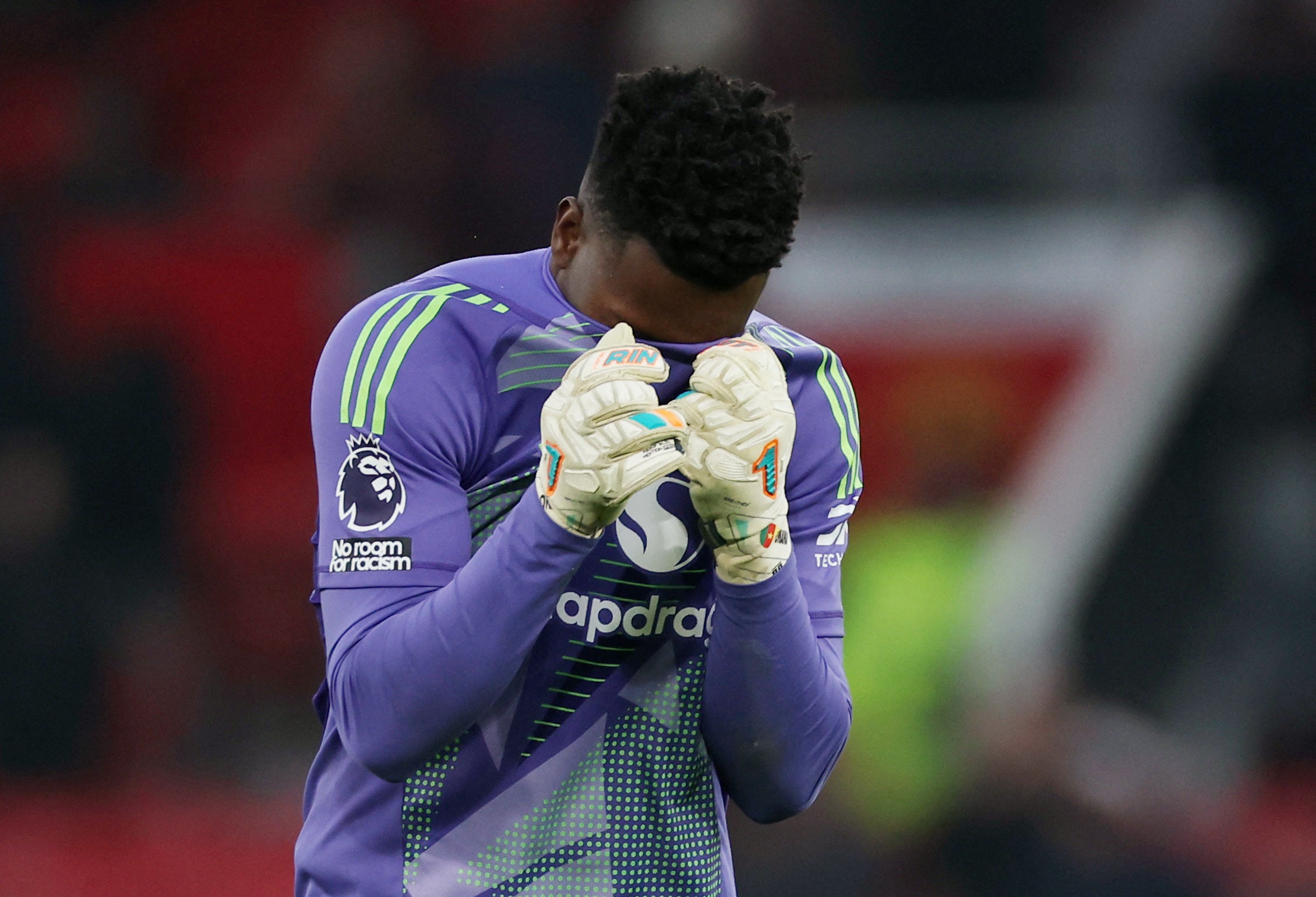 Manchester United goalkeeper Andre Onana reacts after his latest blunder