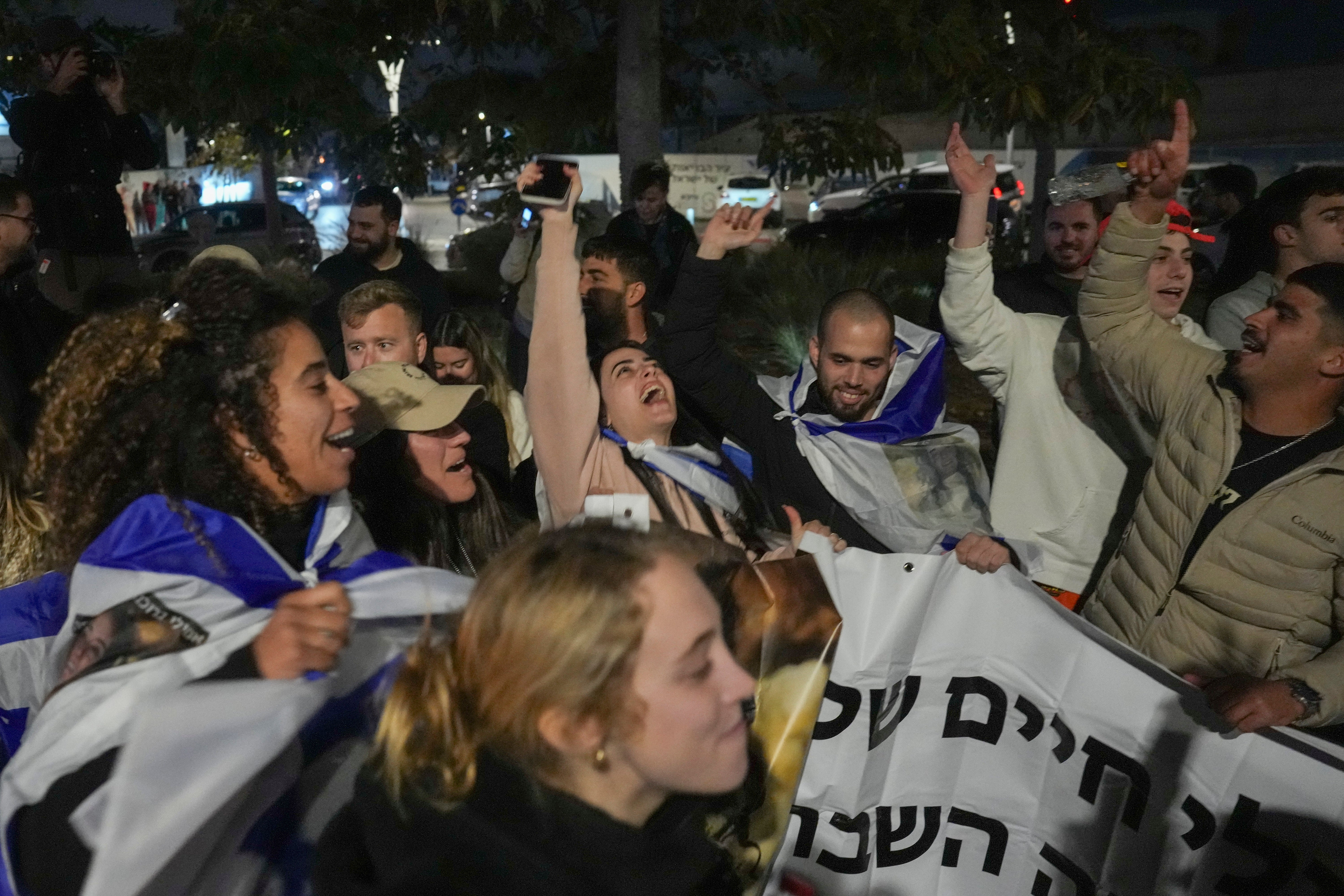 Israelis celebrate the release of the three hostages as they gathered in Tel Aviv, Israel, on Sunday