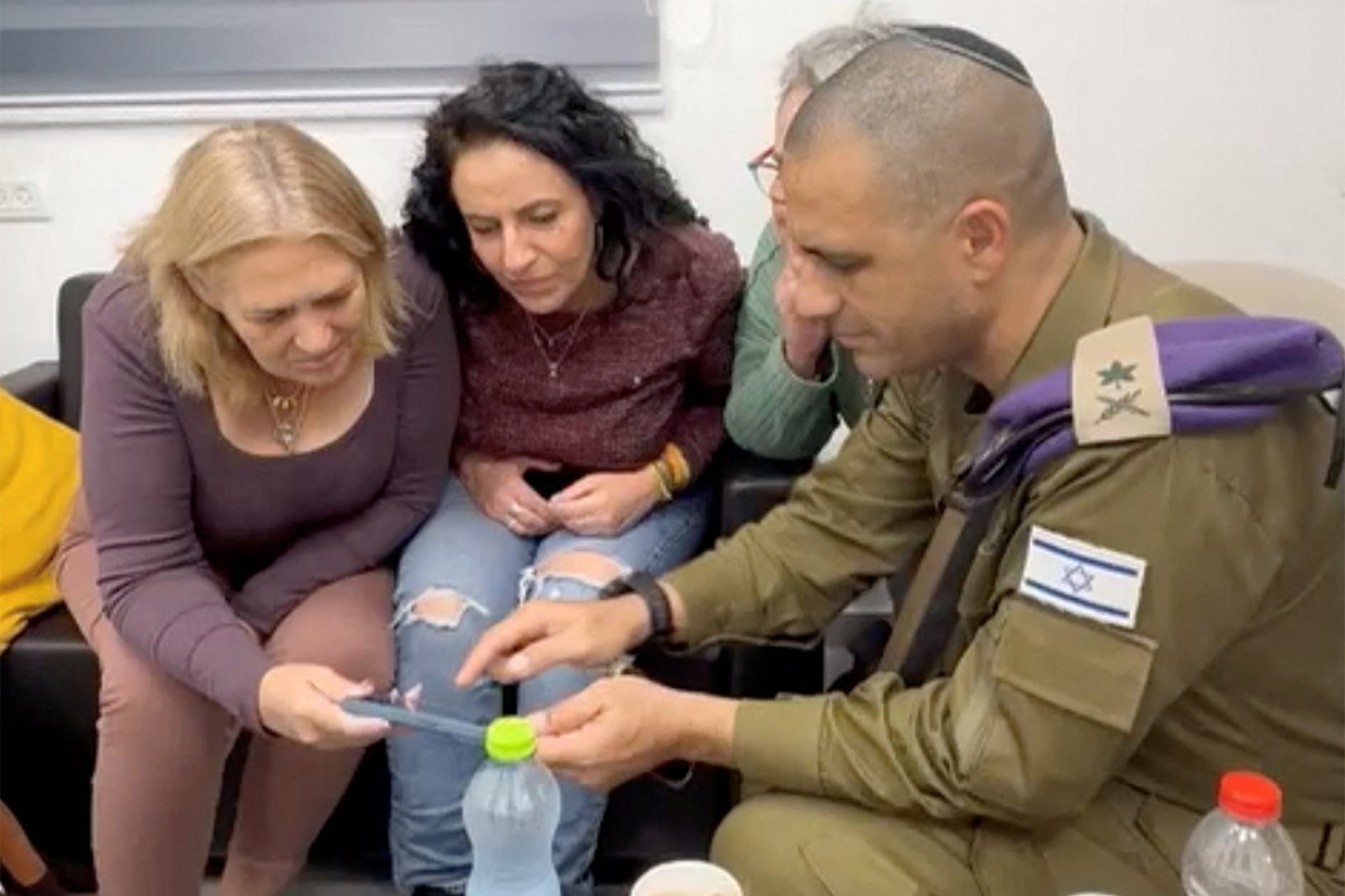 The mothers of hostages Romi Gonen, Doron Steinbrecher and Emily Damari, watch footage of their release