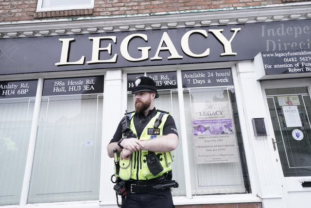 Police outside the branch of Legacy Independent Funeral Directors in Hull (Danny Lawson/PA)