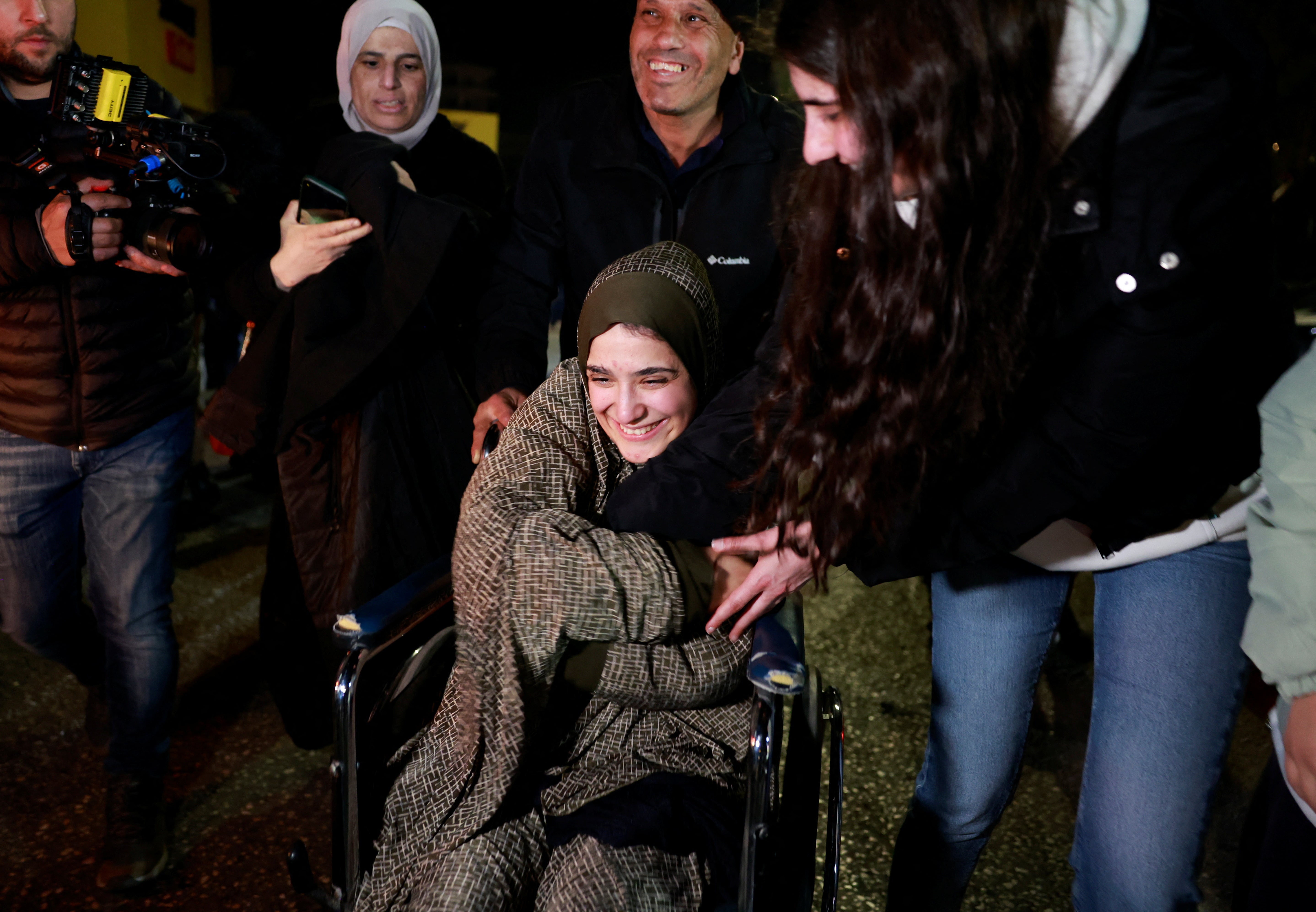 A freed Palestinian prisoner is greeted after being released from an Israeli jail